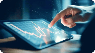 Hand on a tablet reviewing financial numbers