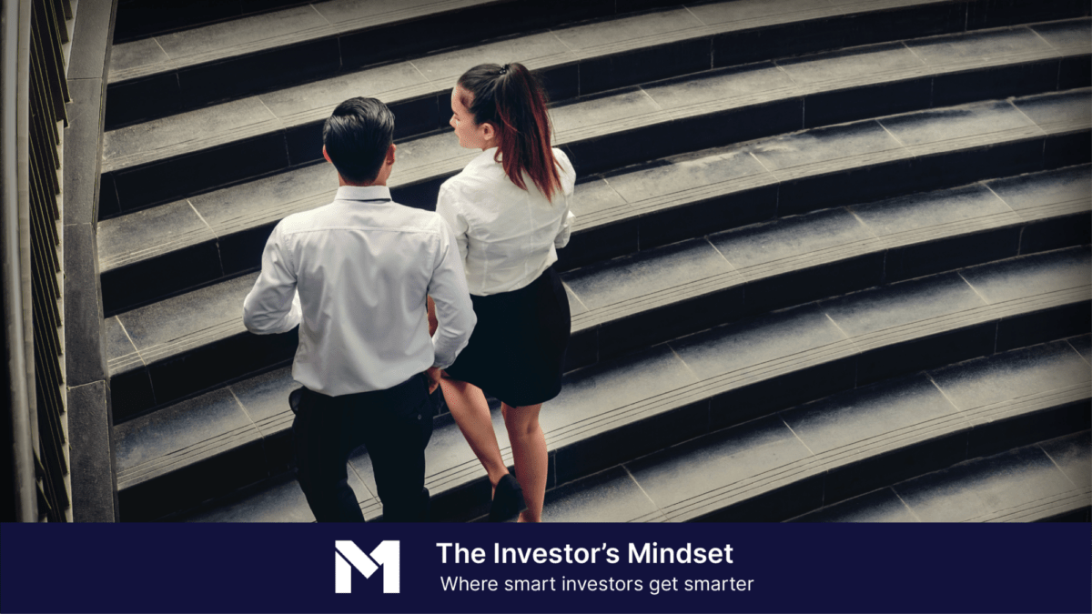 Two business people walking up concrete staircase with a with banner text that reads "The Investor's Mindset, where smart investors get smarter"