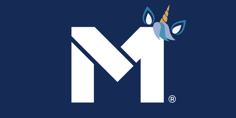 The M1 Logo with a unicorn horn, ears, and a tuft of hair sticking up off the top right corner of the M