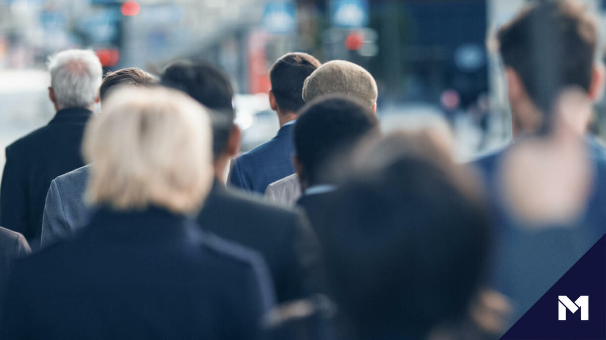 Business people walking to work in a city