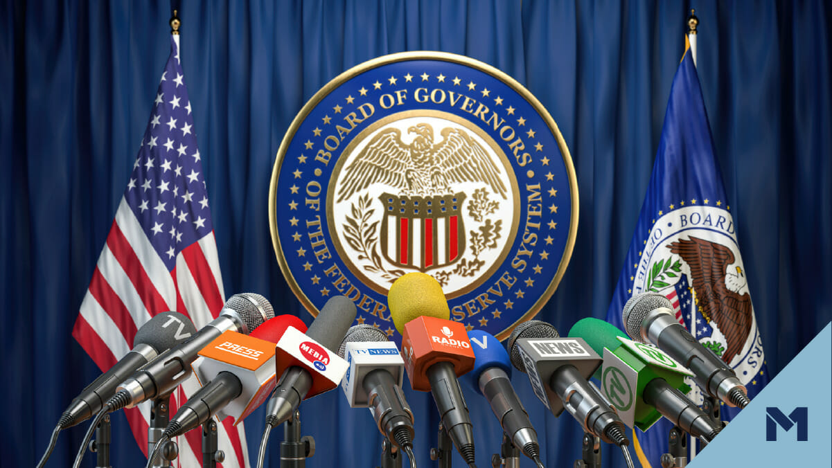 Press conference with the seal of the Board of Governors of the Federal Reserve System in the background