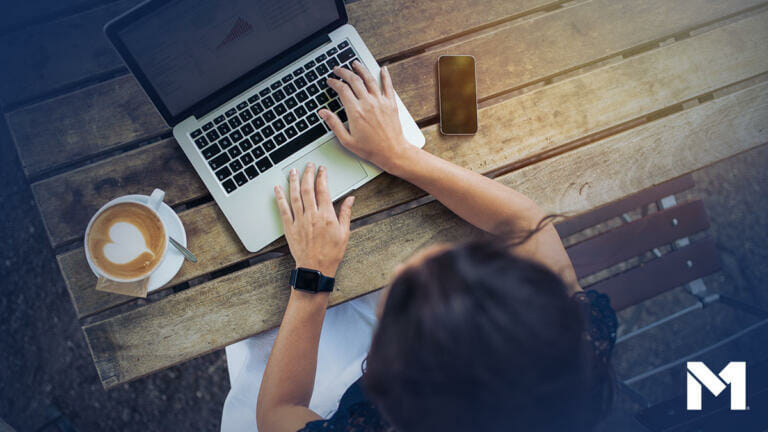 Blog, woman on laptop at picnic table