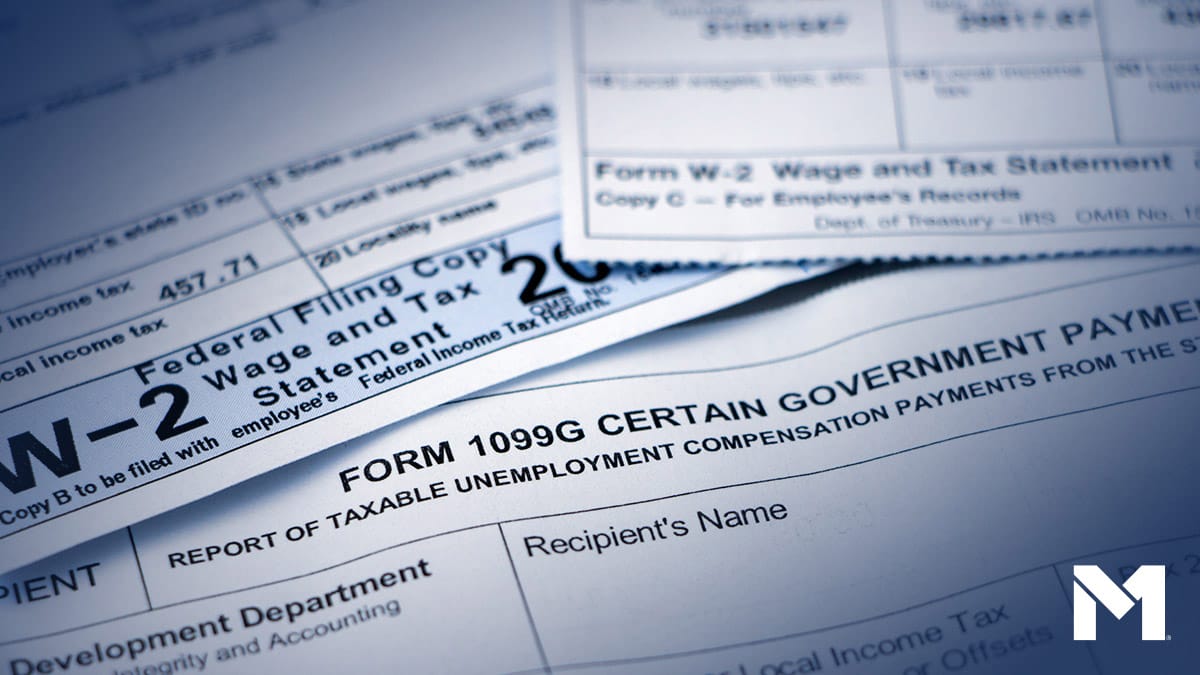 Closeup of several IRS tax forms including W-2 and 1099G.